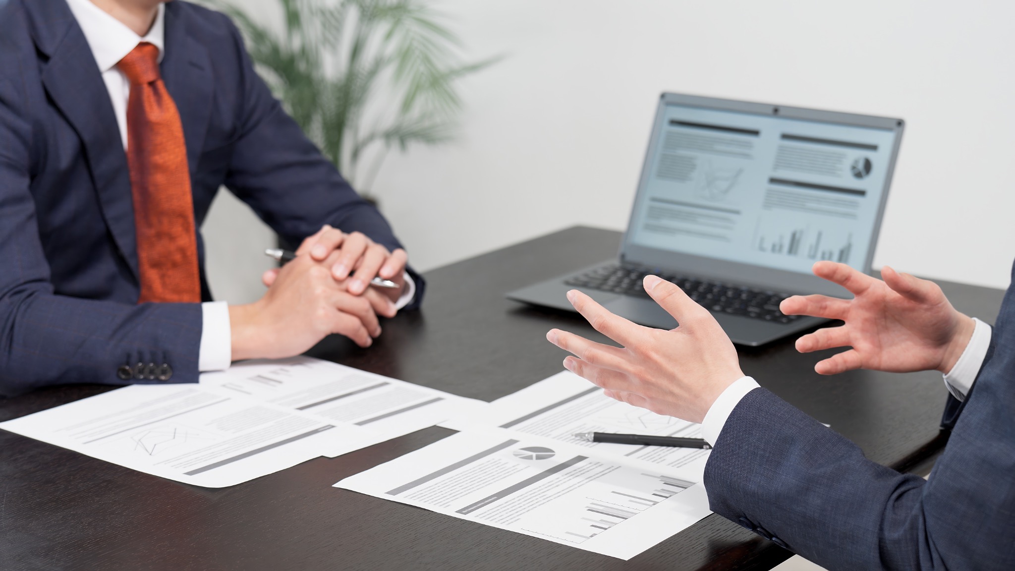 Business conversation around a table